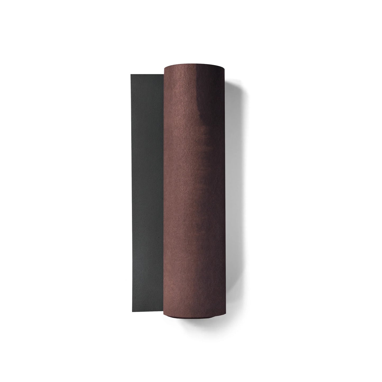 Two cylindrical objects, one black and one brown, on a white background