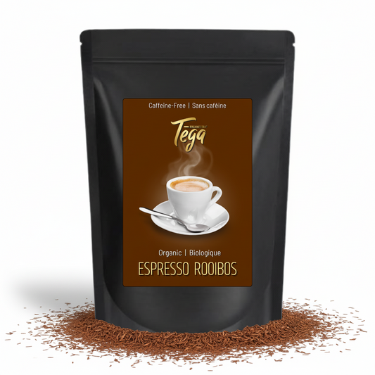 Tega Espresso Rooibos packaging with a cup of tea on a brown background