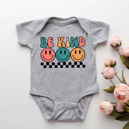 Checkered Be Kind Smiley Face | Baby Graphic Short Sleeve Onesie by The Juniper Shop