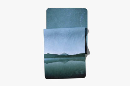 Notebook with a mountain landscape design on a white background