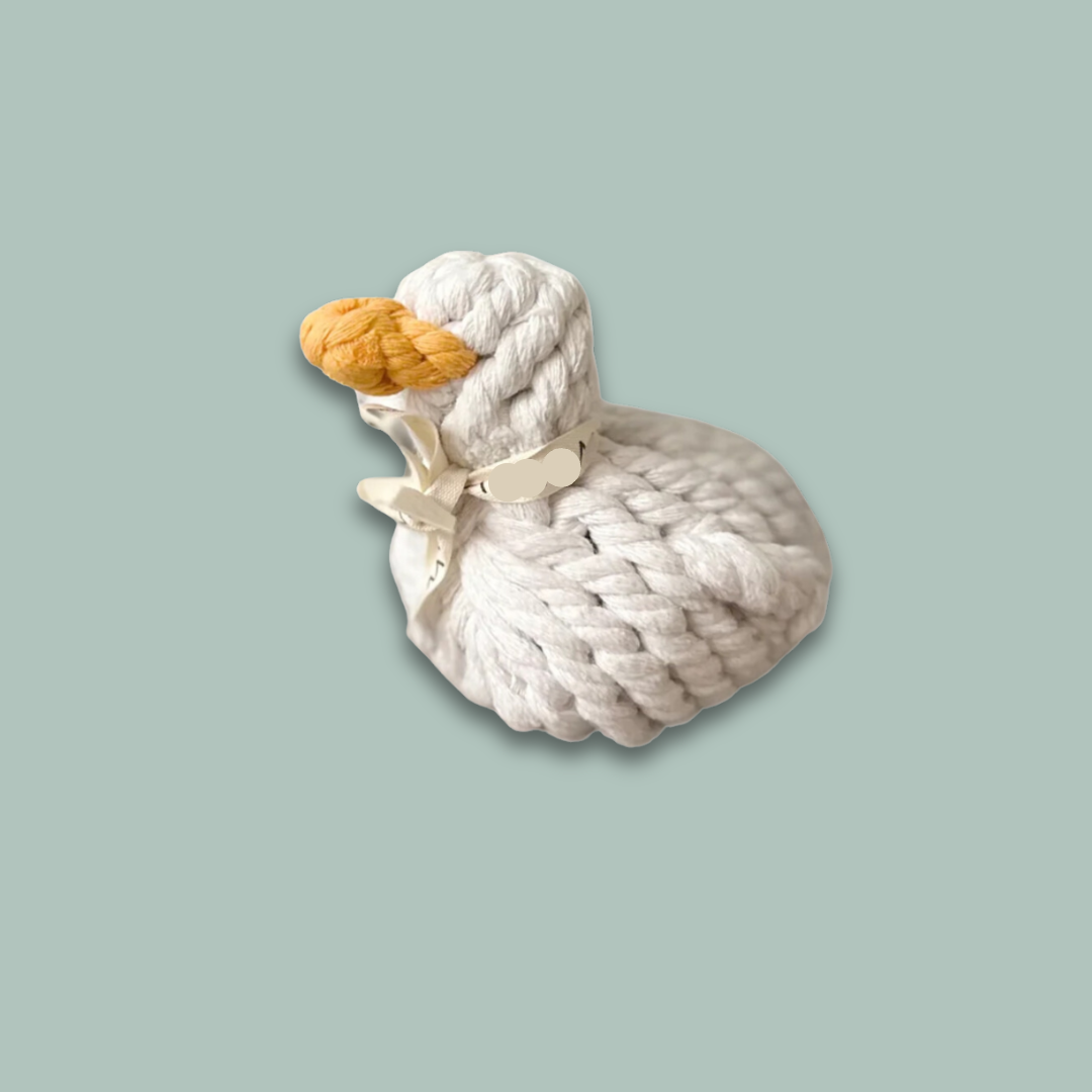 Side view of a white duck pet toy, intricately woven from durable cotton rope, designed for pets to play and chew.