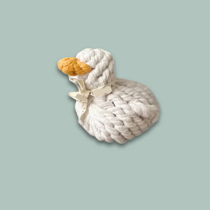 Side view of a white duck pet toy, intricately woven from durable cotton rope, designed for pets to play and chew.