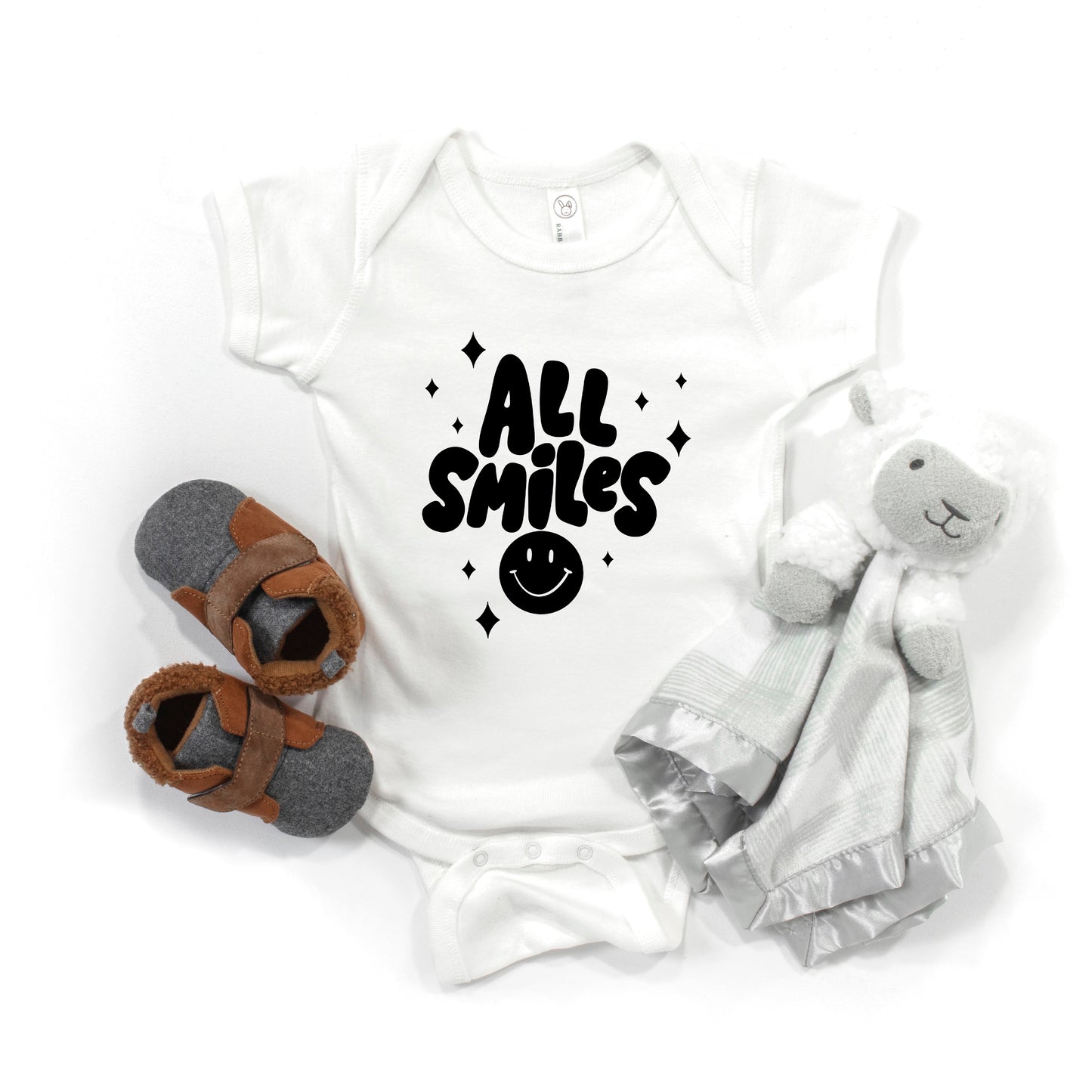 All Smiles Smiley Face | Baby Graphic Short Sleeve Onesie by The Juniper Shop