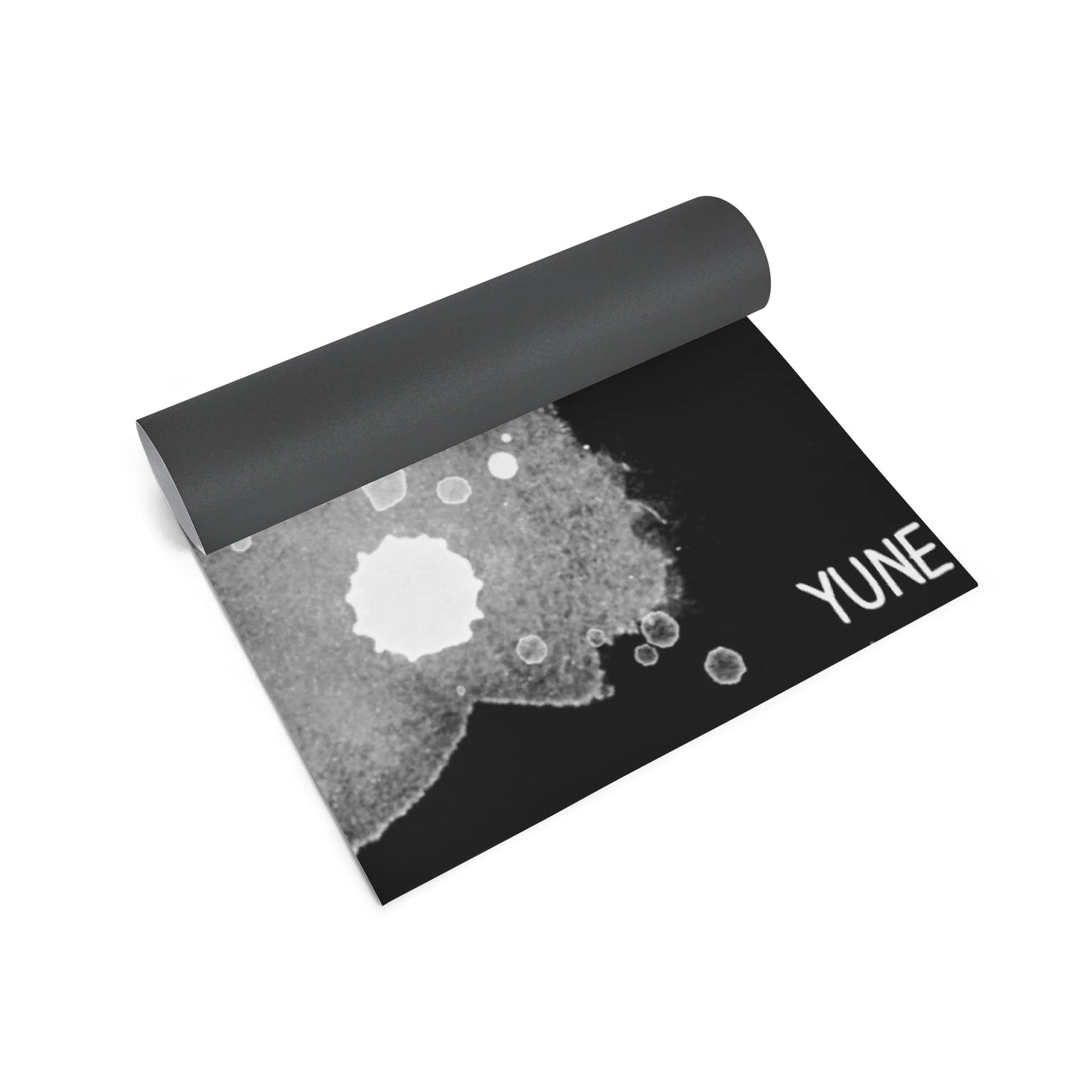 Yoga mat with black and gray design on a white background