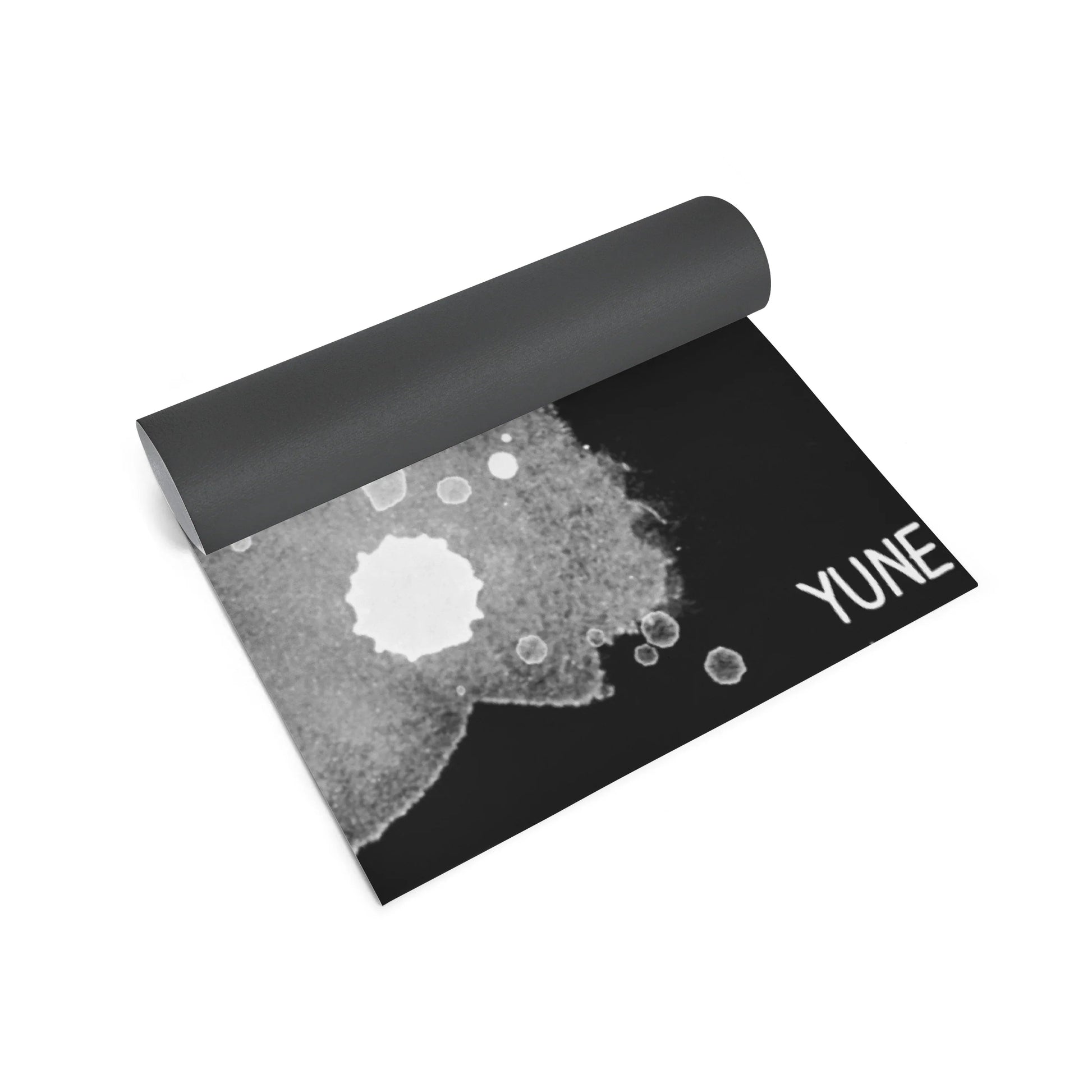 Yoga mat with black and gray design on a white background