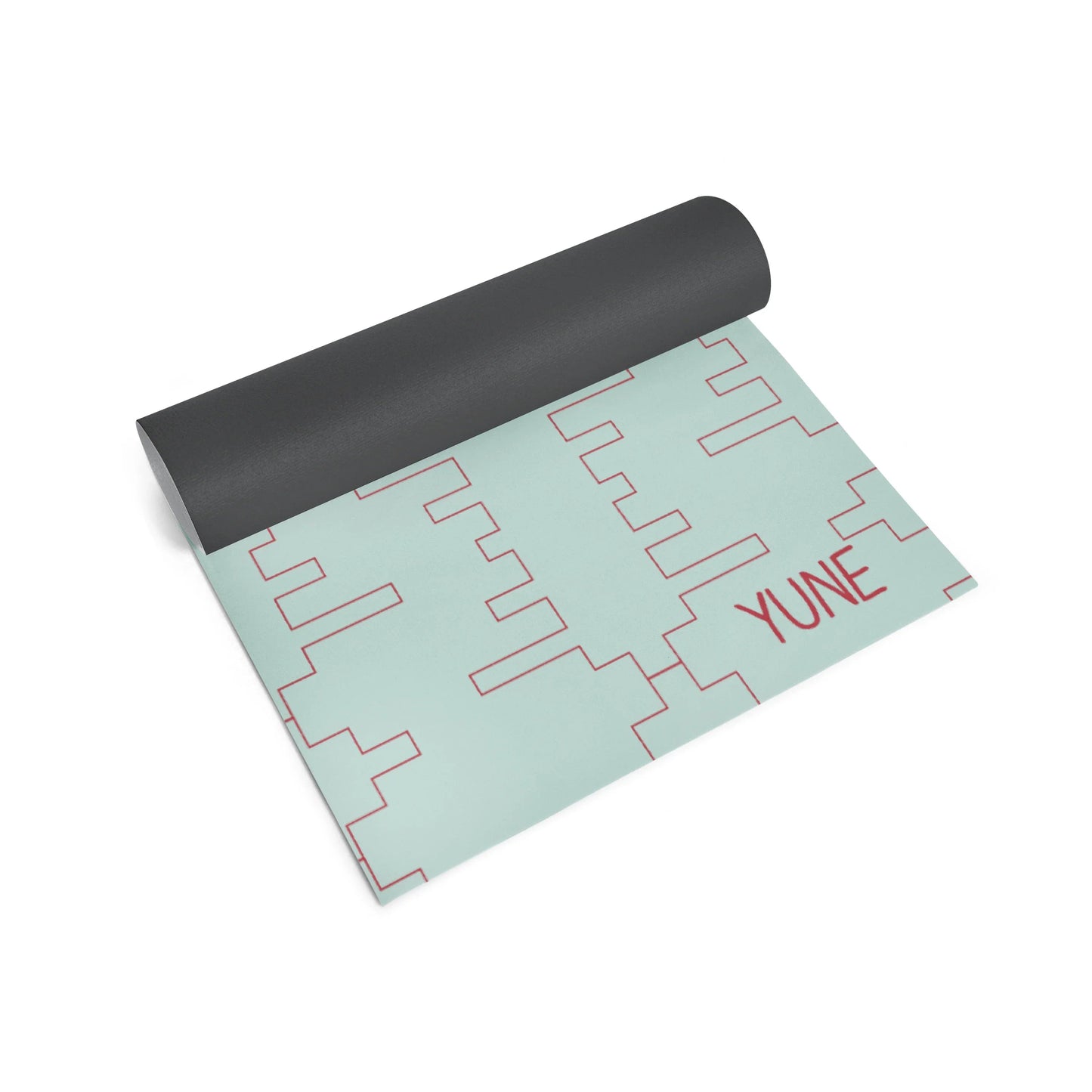 Yoga mat with geometric pattern and 'YUNE' branding on a white background