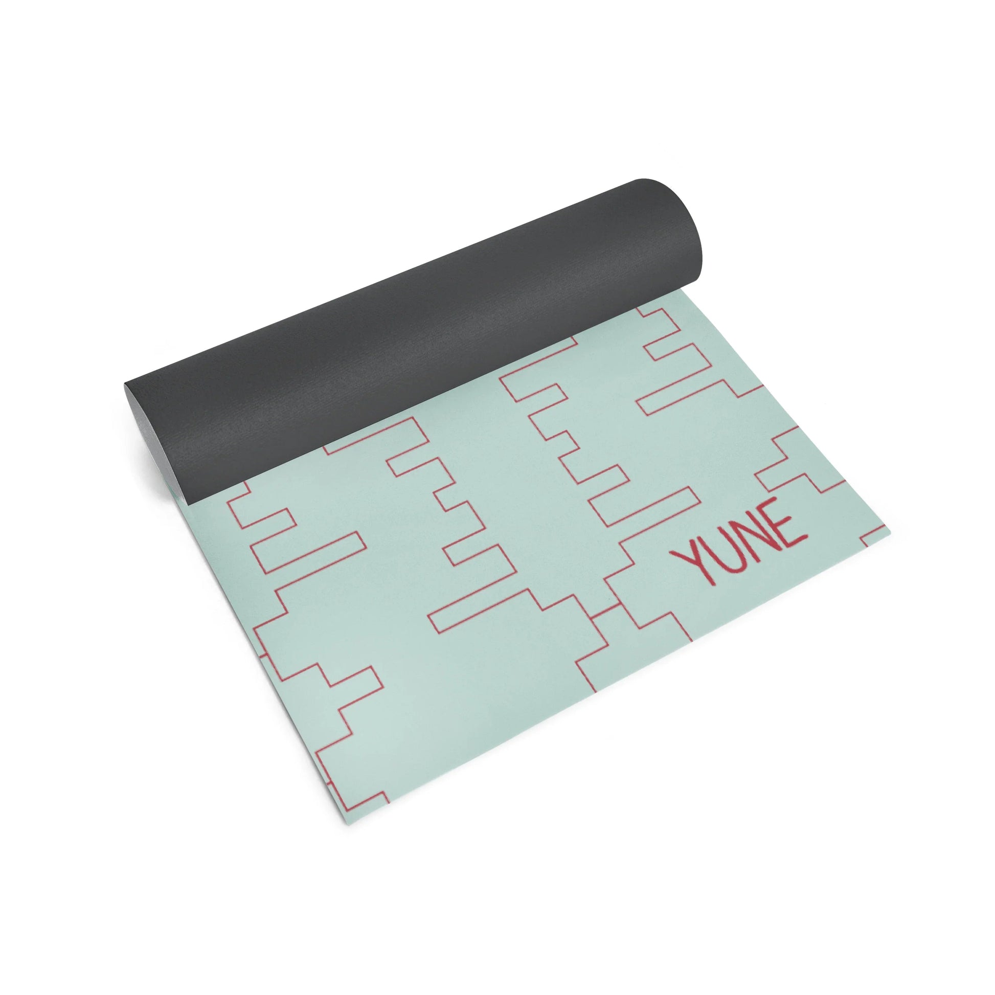 Yoga mat with geometric pattern and 'YUNE' branding on a white background