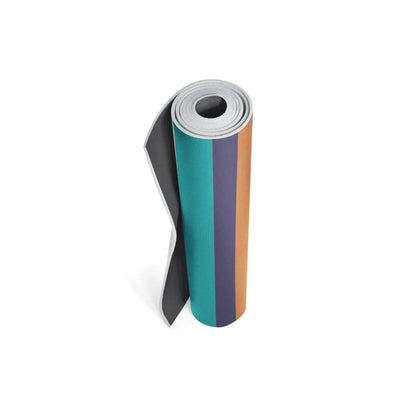 Roll of colorful paper with black, teal, purple, and orange stripes on a white background