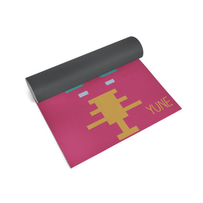 Yoga mat with pink design and 'Yune' branding on a white background