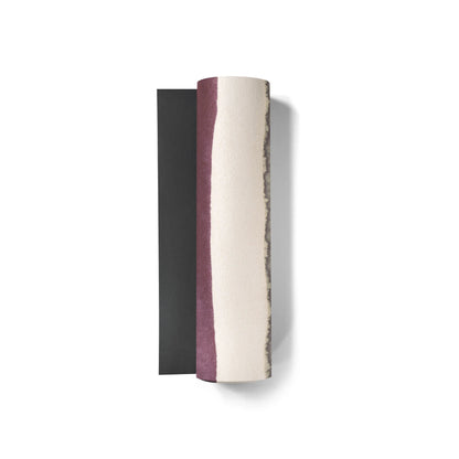 Three cylindrical objects with different color patterns on a white background