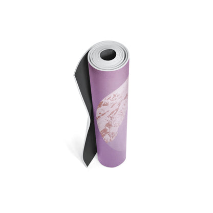 Rolled-up yoga mat with a pink and white design on a white background