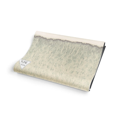 Yoga mat with a textured pattern on a white background