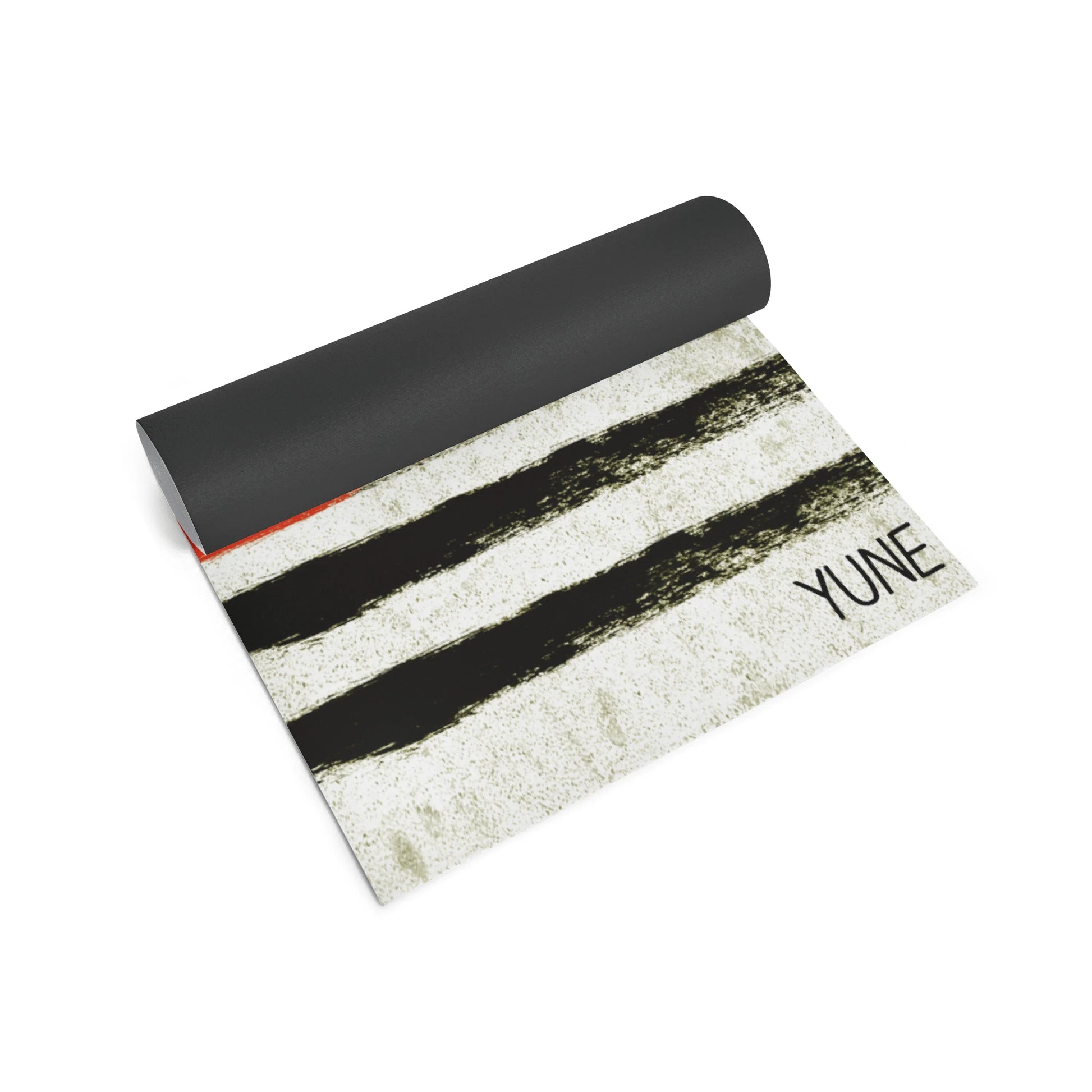 Yoga mat with black and white design and 'YUNE' branding on a white background